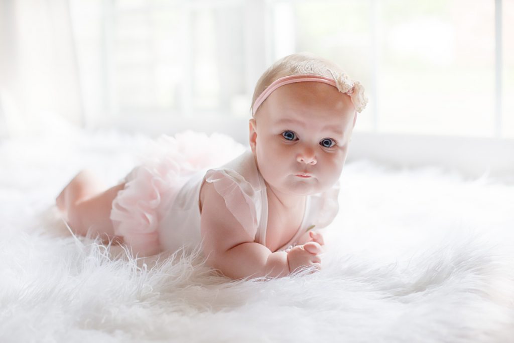 Lexington, KY Newborn Photographer picture of 6 month old baby pushing up on belly
