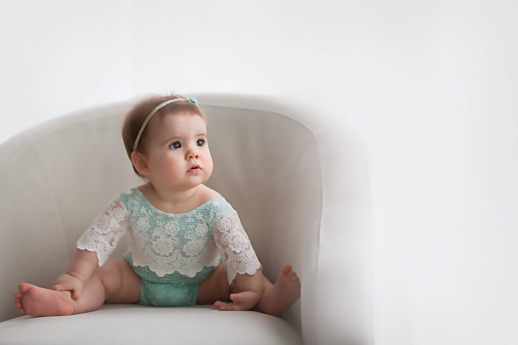 Lexington, KY newborn photographer of baby in lace sitting in a chair