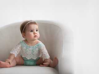 Lexington, KY newborn photographer of baby in lace sitting in a chair