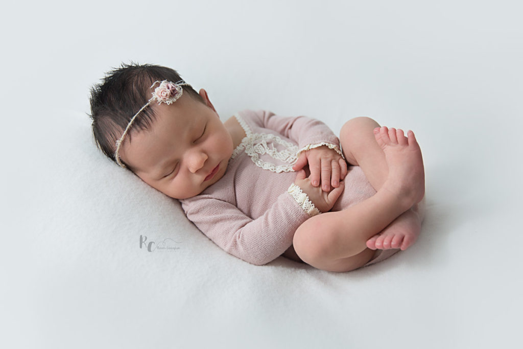 Vintage style portrait of newborn baby girl in dusty rose by Rhonda Cunningham Photography, Lexington Ky newborn photographer.