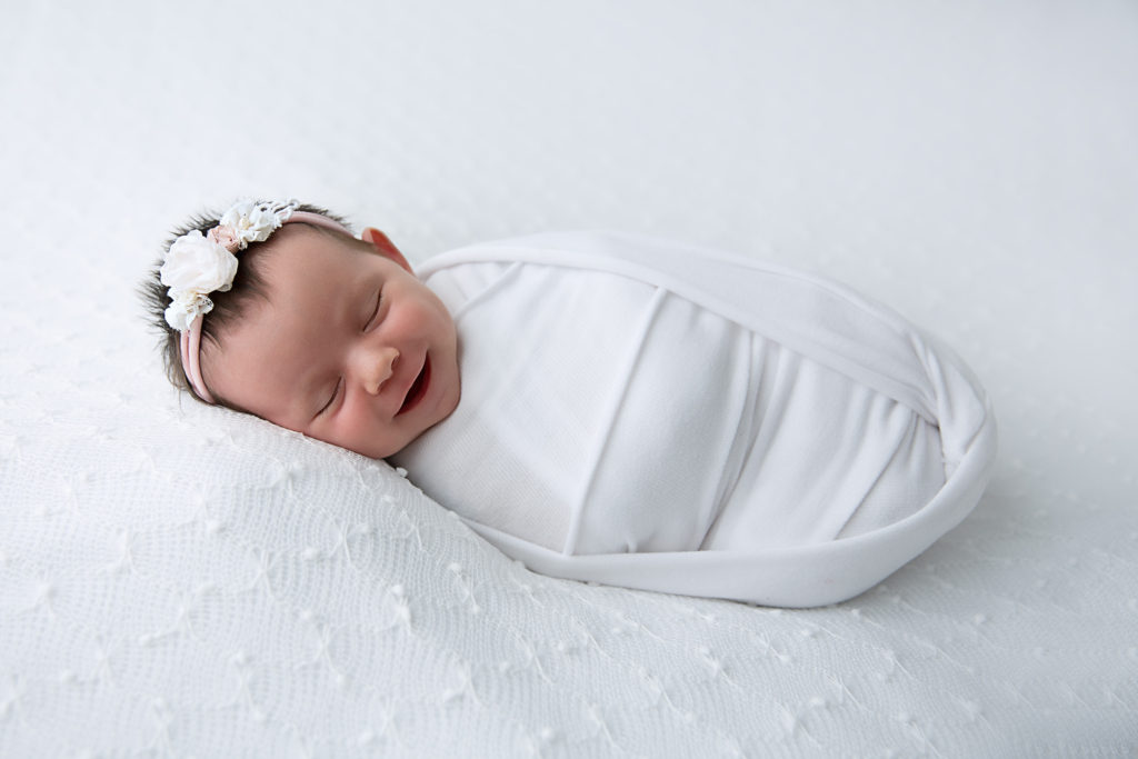 picture of newborn baby girl swaddled in white by Rhonda Cunningham Photography, newborn photographer lexington ky